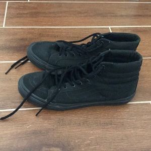 All black high top Vans